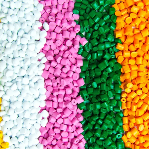 Colorful-ABS-plastic-pellets-arranged-in-vertical-rows-scaled